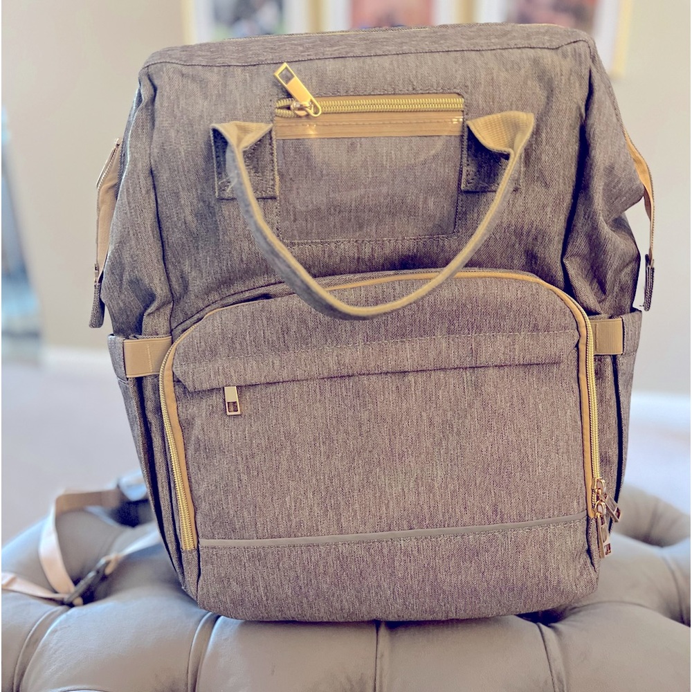 Diaper bag backpack with changing station